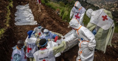 Members of the Congolese Red Cross carry body bags containing human remains during a mass burial for victims of the clashes, Bukavu, DRC, Feb. 20, 2025. (AFP Photo) 