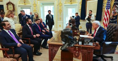 U.S. President Donald Trump meeting with Syria's President Ahmed al-Sharaa (2nd L), seated alongside Syrian Foreign Minister Asaad al-Shaibani at the White House, Washington, D.C., U.S., Nov. 10, 2025. (SANA Handout via AFP Photo)