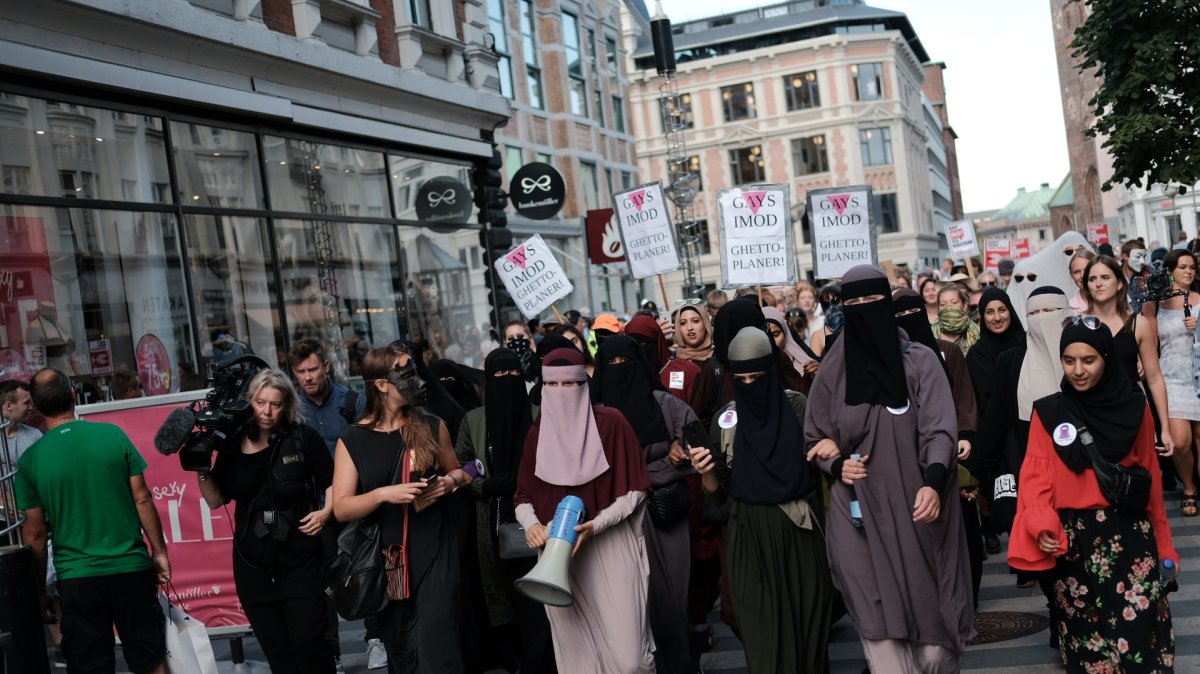 Thousands of people protest in defiance of the Danish Governments ban on the burka and niqab in Aarhus, Denmark, Aug. 1, 2018. (Getty Images Photo)