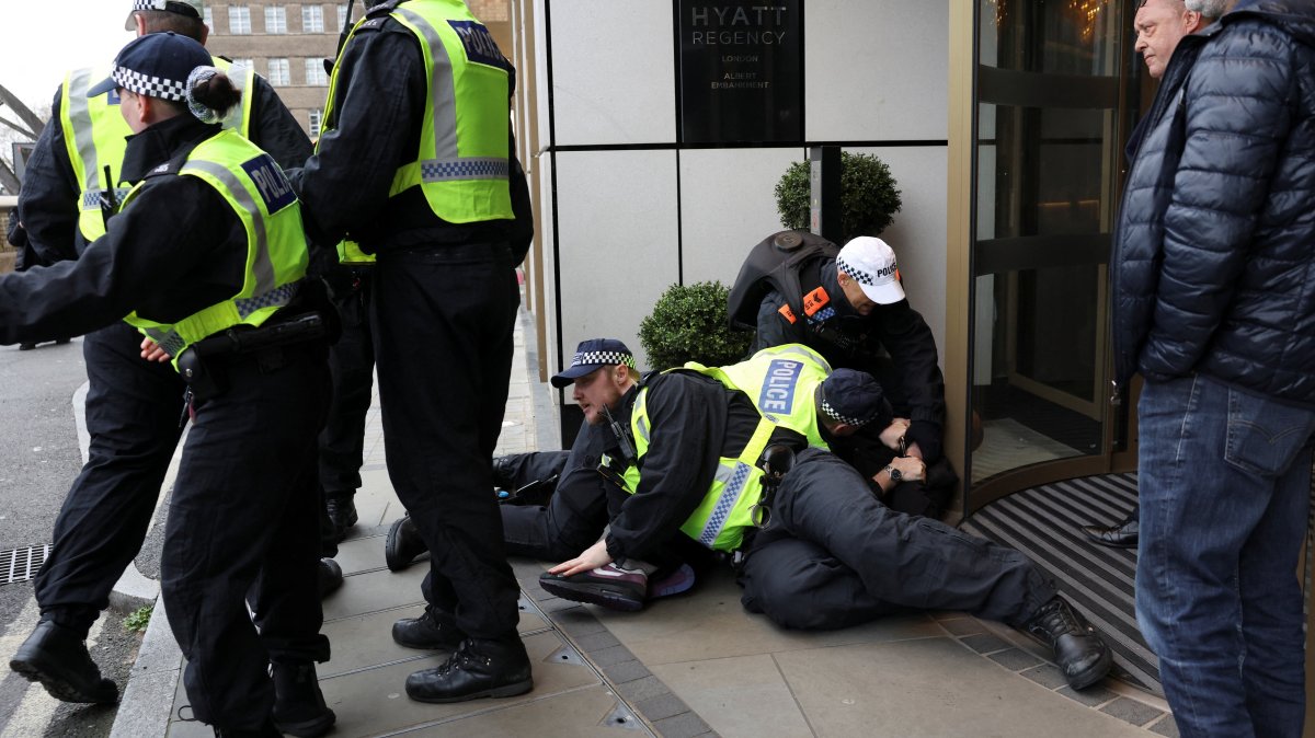 A person is detained on the day of a static protest to mark Al-Quds Day in support of the Palestinian people organised by the Islamic Human Rights Commission and a counter-protest, in London, Britain, March 15, 2026. (Reuters Photo)