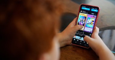 A boy uses a social media platform in Brasilia, Brazil, March 19, 2026. (AP Photo)
