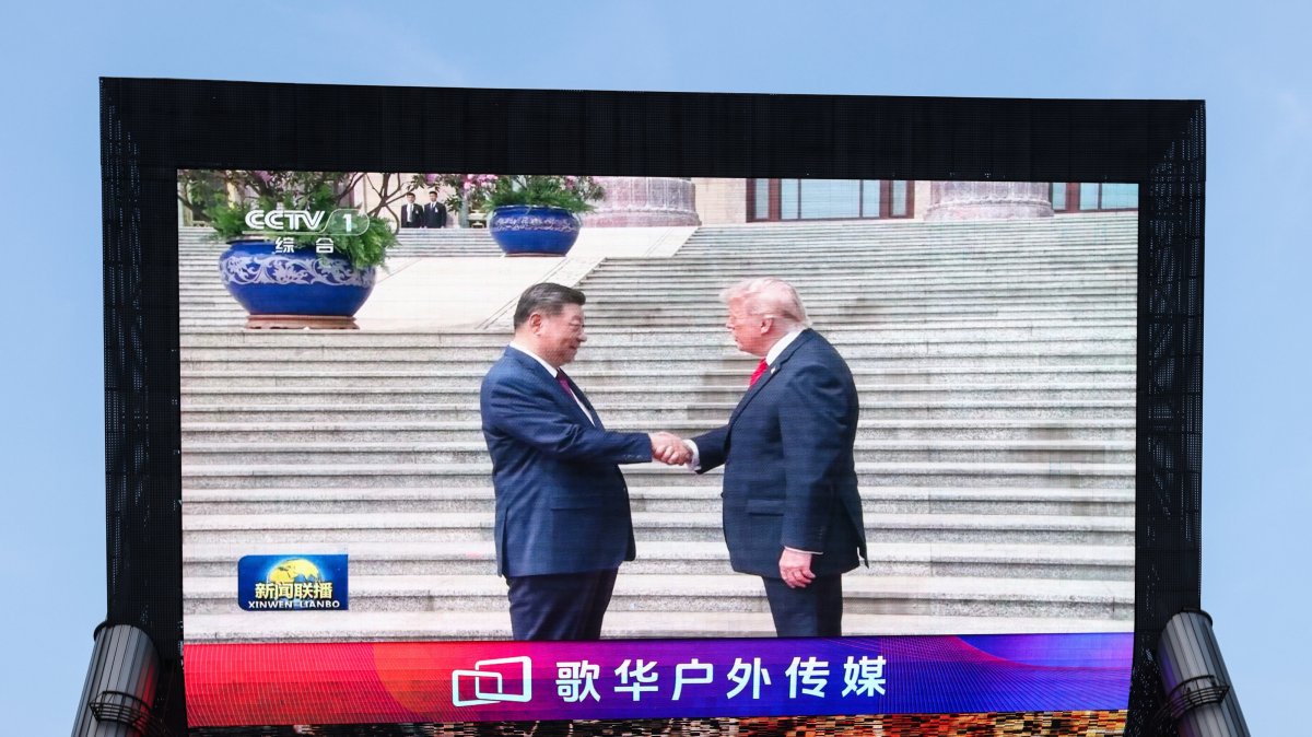  A screen shows Chinese President Xi Jinping shaking hands with U.S. President Donald Trump during their meeting in Beijing, China, May 14, 2026. (EPA Photo)