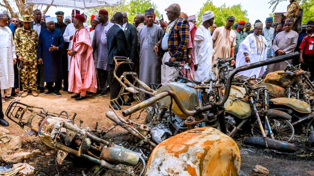 Adamawa State Governor Ahmadu Umaru Fintiri, left white hat, inspects an area that was attacked by Militants with the Daesh terrorist group, in Guyaku, northeastern Nigeria, April 27, 2026. (AP Photo)