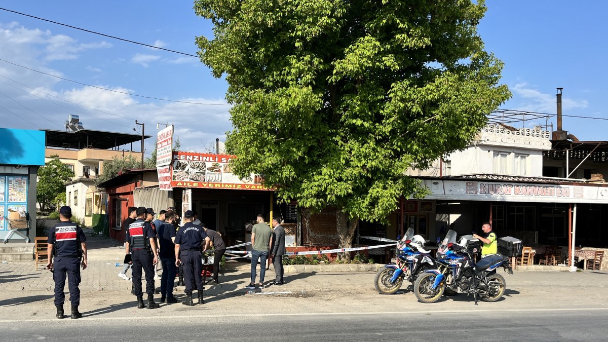Police officers stand outside a restaurant that was the scene of a shooting that left four dead, six others injured in southeastern Mersin province, Türkiye, May 18, 2026. (AA Photo)