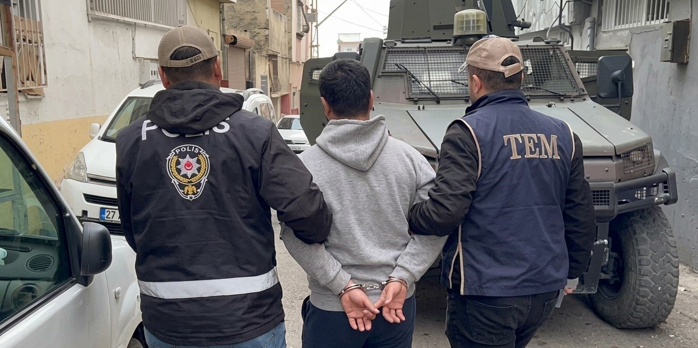 This AI-enhanced image shows a Daesh suspect escorted by counterterrorism police in an undisclosed location, April 13, 2026. (AA Photo) 